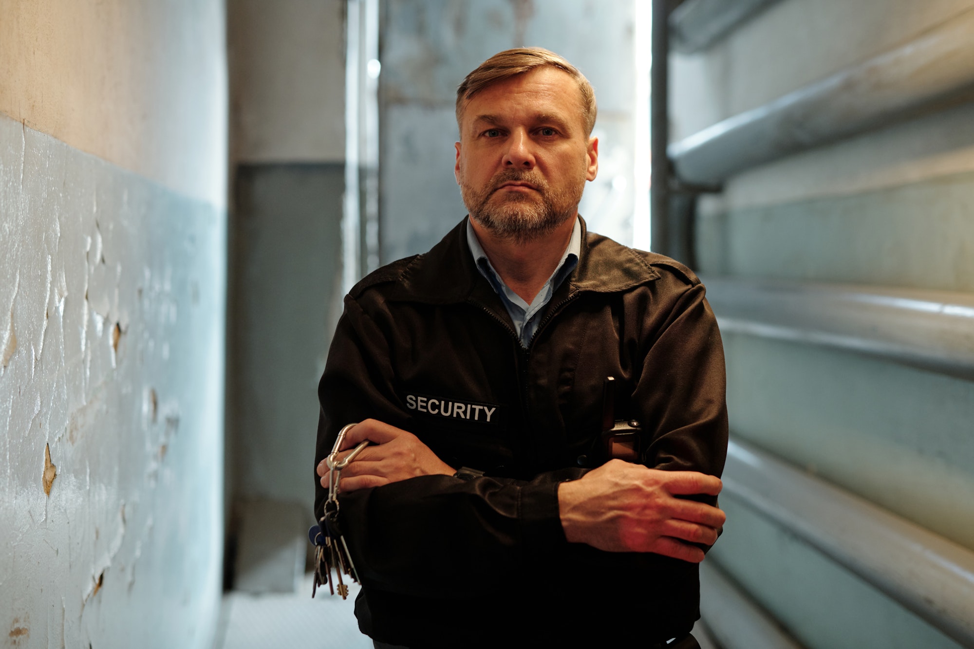 Mature security guard in black uniform